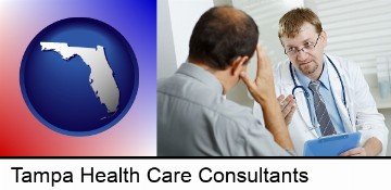 a doctor consulting with a patient about health symptoms in Tampa, FL